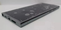 A black s23 ultra shown from an angled top-down view on a light gray background.